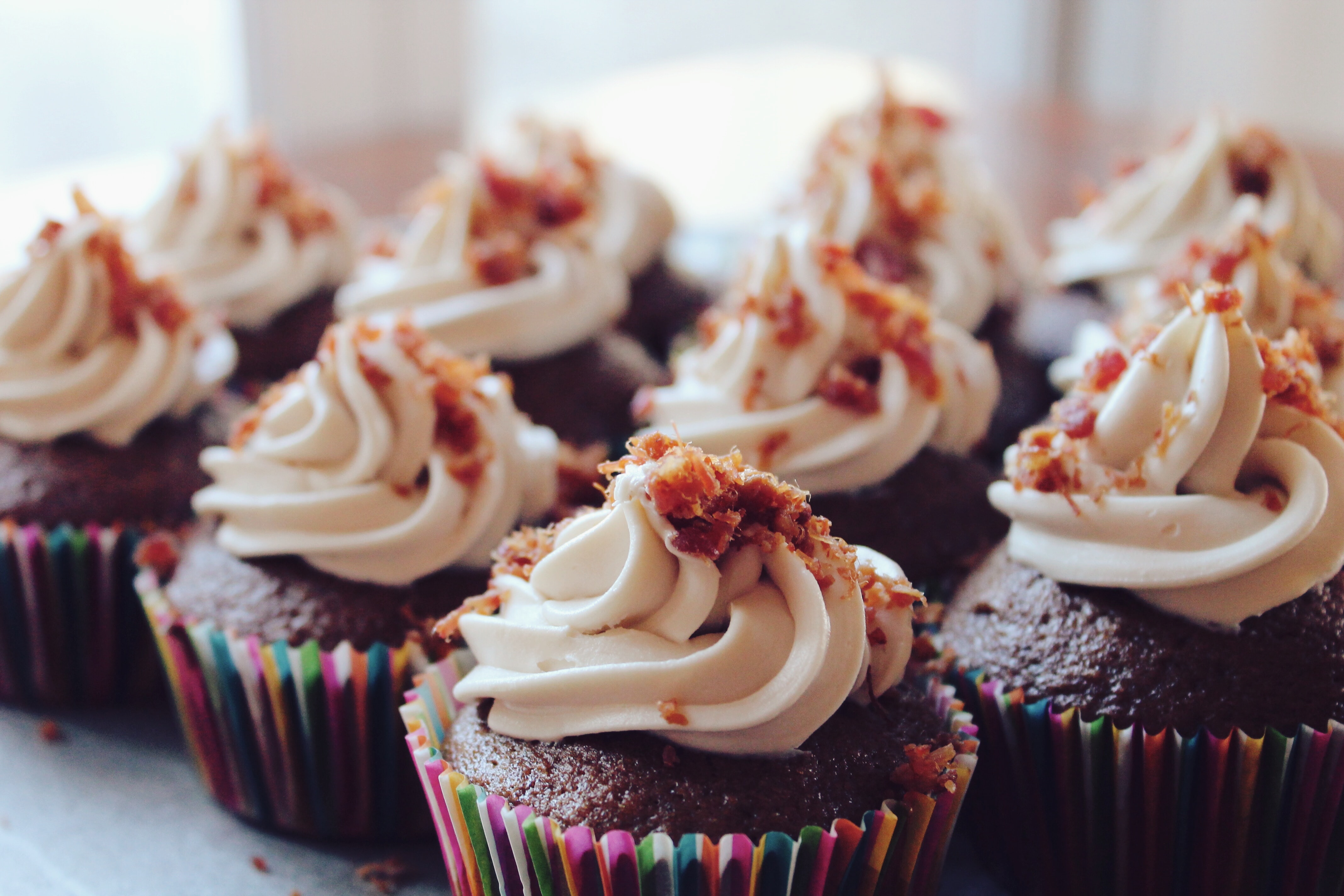 Chocolate Bacon Cupcakes with Maple Frosting in rainbow cupcake cups